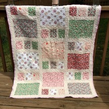 http://cutefluffinstitch.com/item/baby-quilt-oversized-crib-pink-grey-red-green-and-cream-handmade-quilts